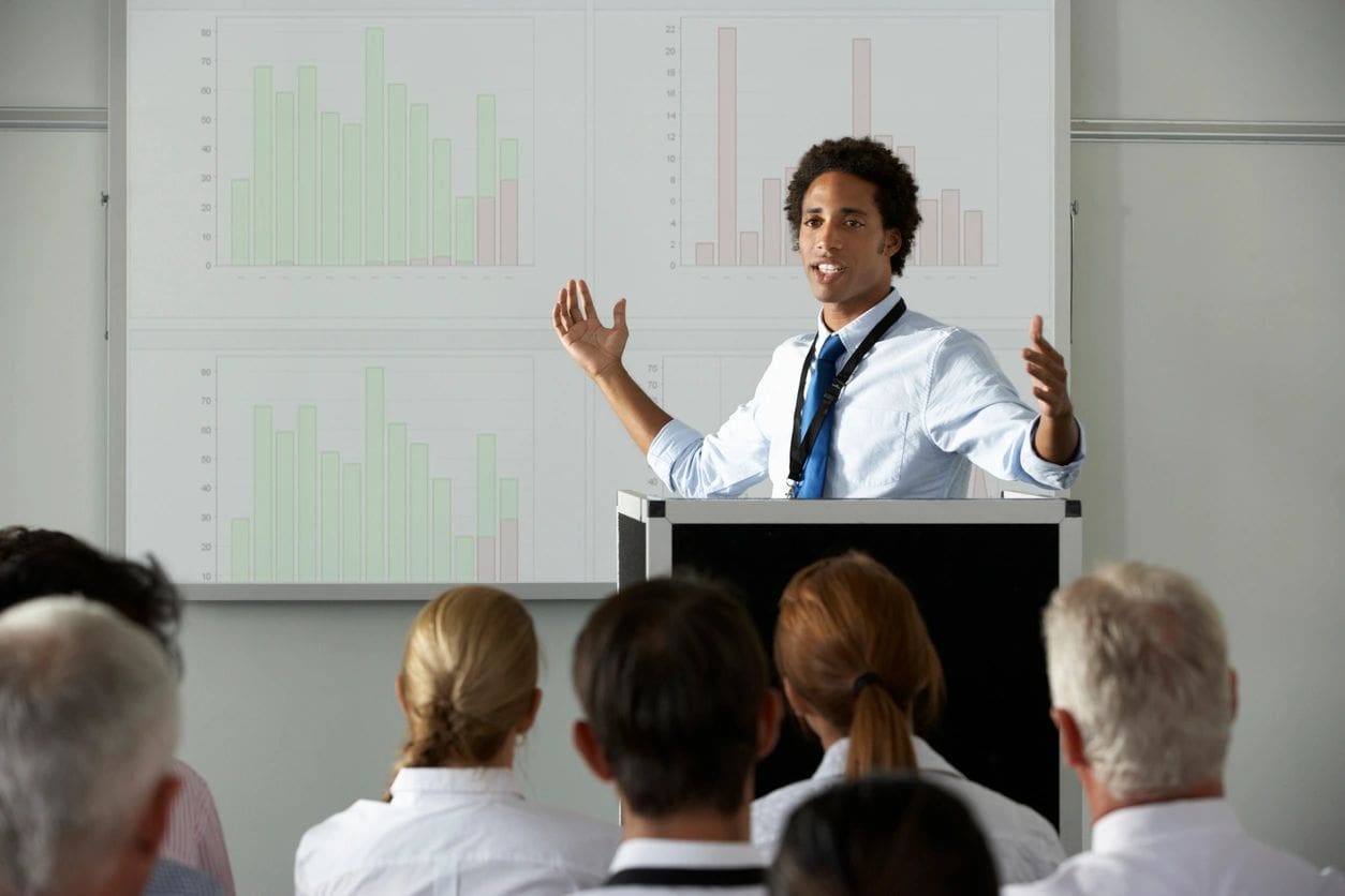 A man is giving a presentation to an audience.